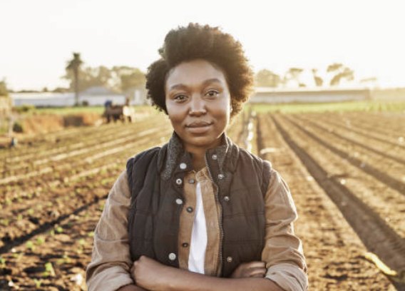 A grower standing in her field