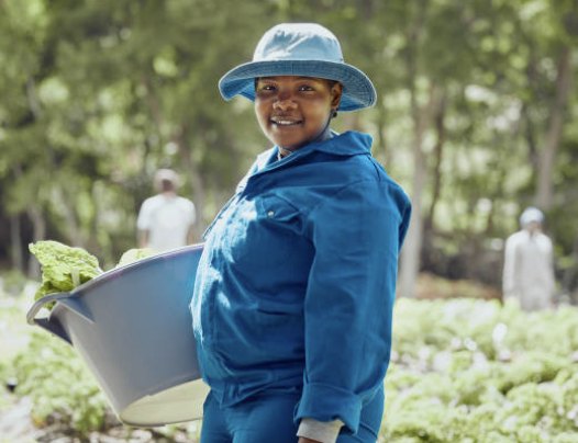 A farmer carrying a fresh harvest